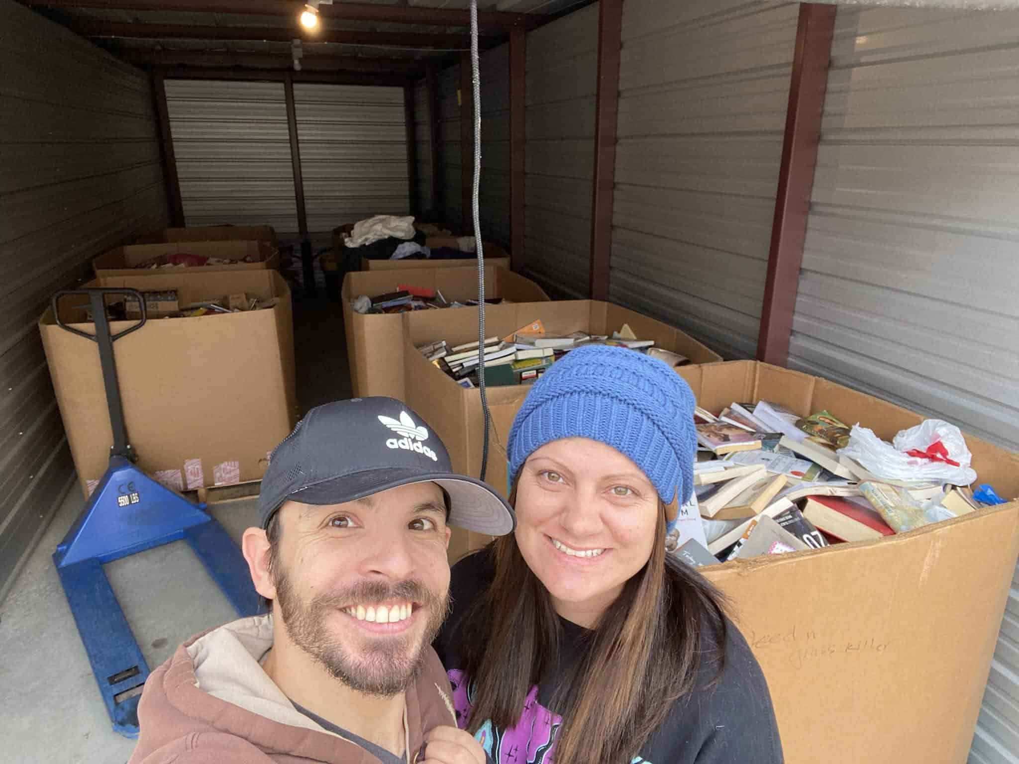 The owners of PNG Enterprises seated with a pallet of books
